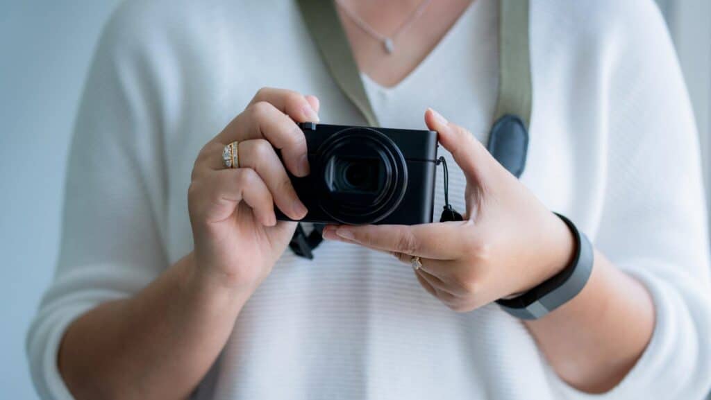 compact camera in woman's hands